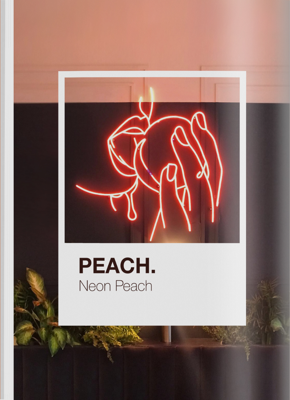 A neon scolpture of a woman eatign a peach